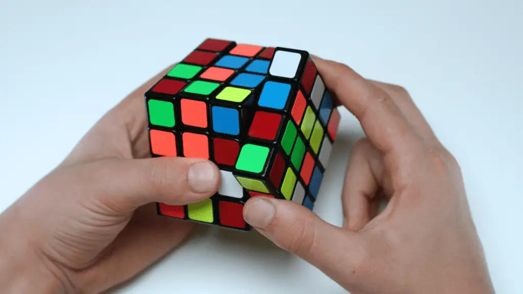 a person holding a rubik's cube